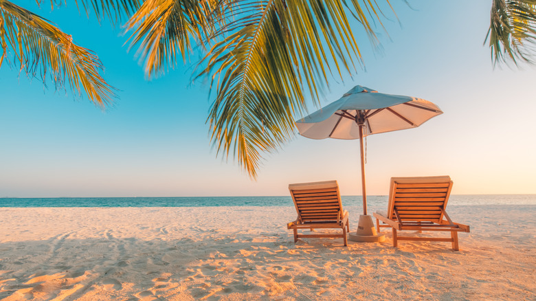 Table and chairs on beach