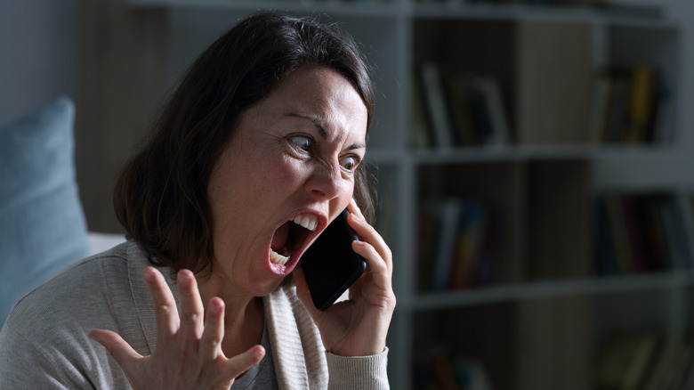 Woman screaming into phone