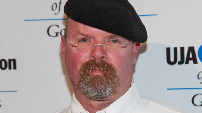 Jamie Hyneman frowns black hat