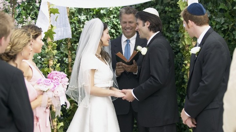 Jewish wedding with couple and rabbi