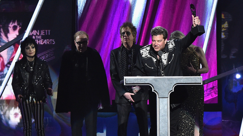 Gary Ryan holding induction award