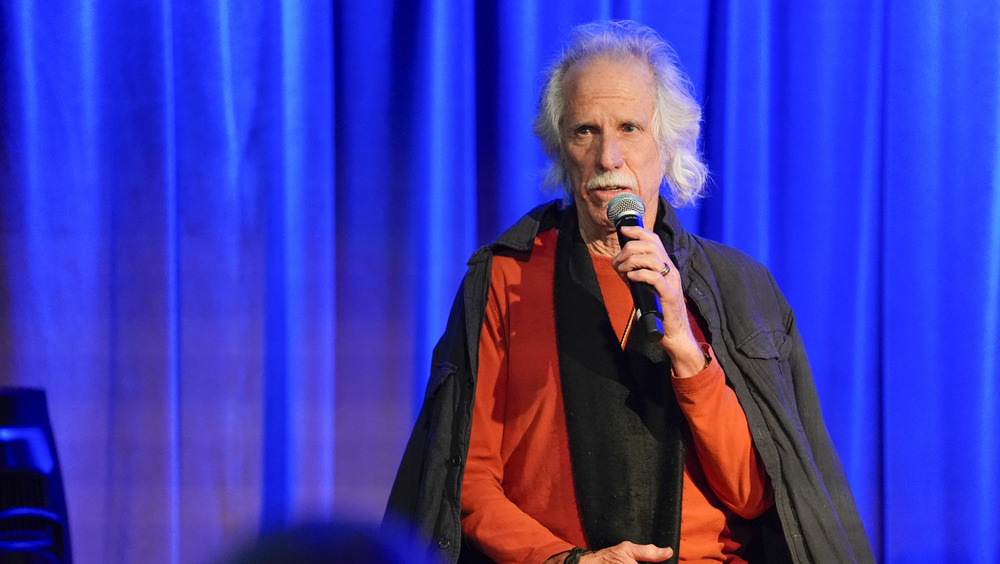 John Densmore speaking to audience