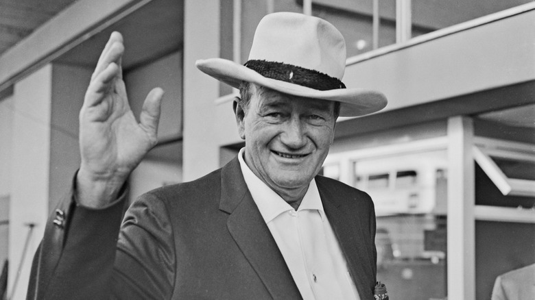 John Wayne waving