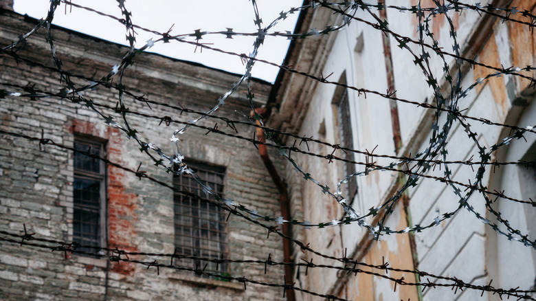 Old Soviet prison with barbed wire