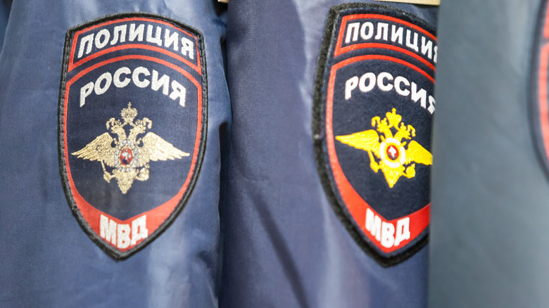 Hangers with the form of police in a specialized warehouse-store of police and military uniforms, as well as insignia for officers