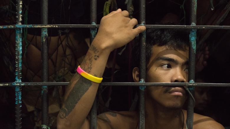 Prisoner in cramped cell