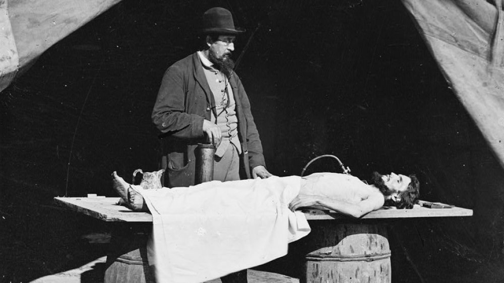 Embalming a dead soldier, 1863
