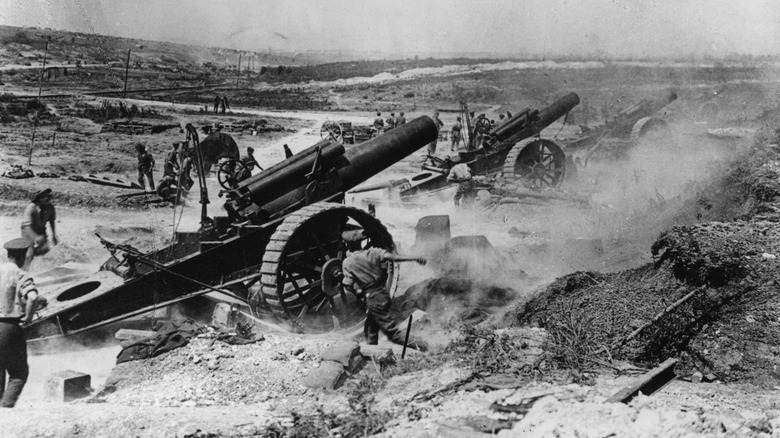 Soldiers operate WWI cannons