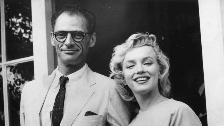 Arthur Miller and Marilyn Monroe outside house