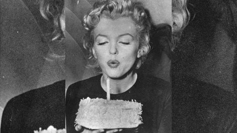 Marilyn Monroe blowing out a candle