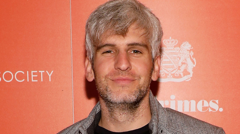 max joseph squinting and smirking at camera