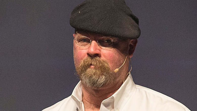 jamie hyneman staring into camera microphone