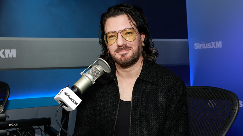 JC Chasez in glasses at microphone