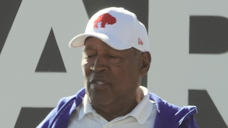 OJ Simpson in white baseball cap