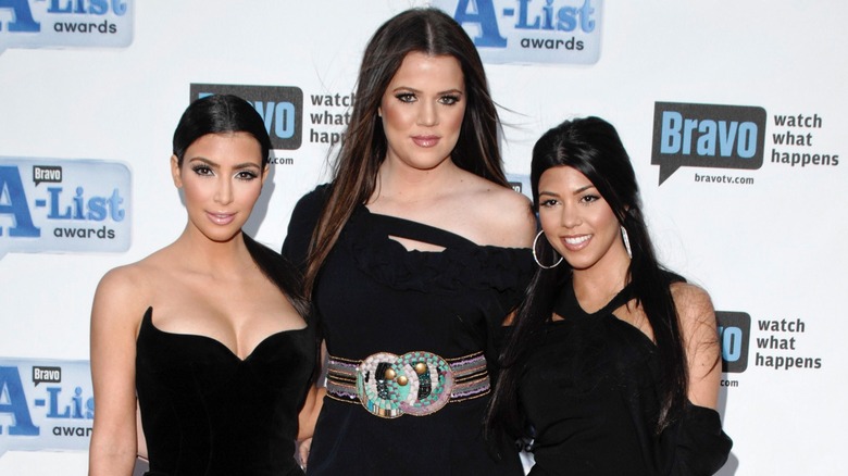 Kim, Khloe, and Kourtney Kardashian posing