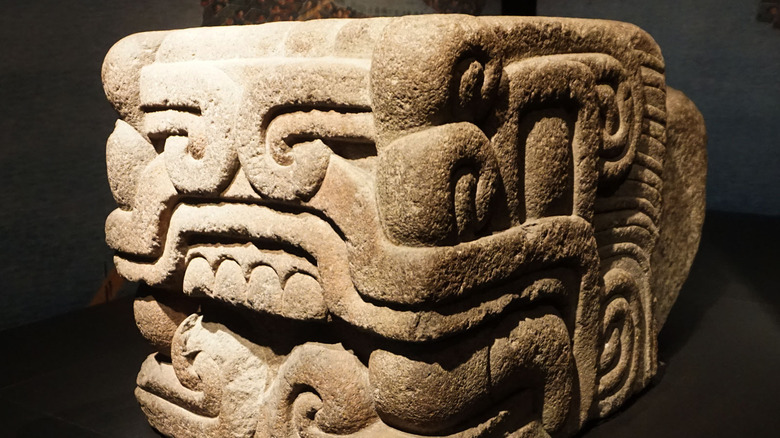 Stone carving of a feathered serpent head from a temple of Quetzalcoatl.