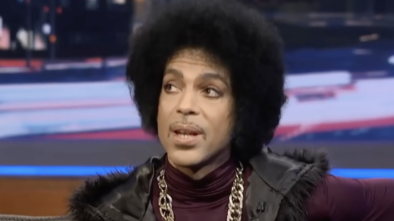 prince looking off during an interview in 2014