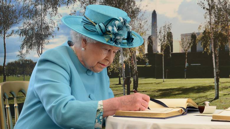 Queen Elizabeth II writing 