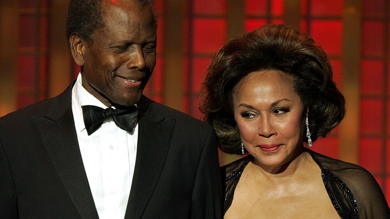 Sidney Poitier smiles at Diahann Carroll