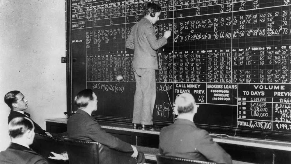 Worker writing on chalkboard 