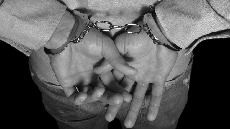 Hands in handcuffs