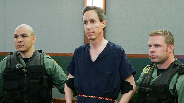 Warren Jeffs in court shackled held by two police officers