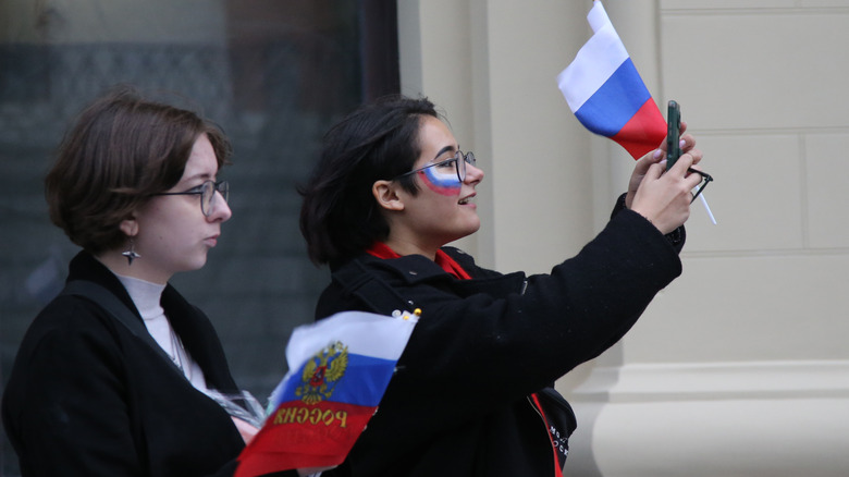 Holding Russian flags in support 