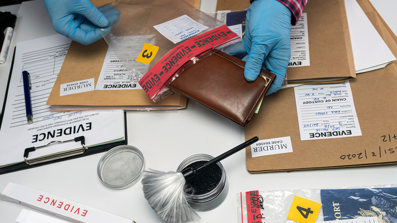 man inspecting evidence