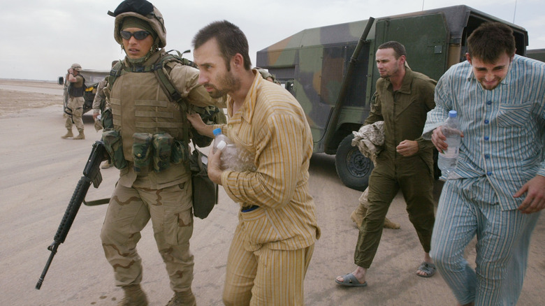 released POWs leaving a helicopter