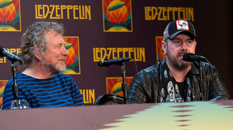 Robert Plant and Jason Bonham on panel with microphones