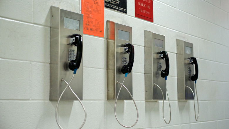 Prison pay phones on wall