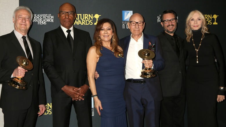 The cast of Star Trek: The Next Generation showing off their award at the Saturn Awards 2024