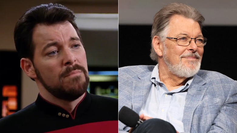 William Riker looking down and Jonathan Frakes dressed in a blazer, wearing glasses, and holding a microphone