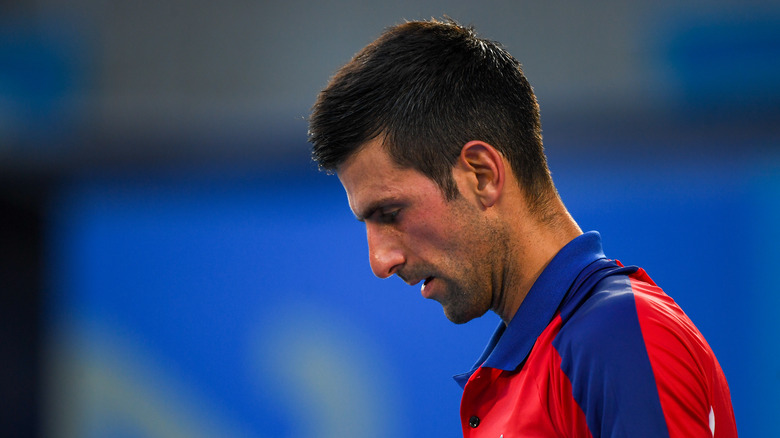 Djokovic looking down