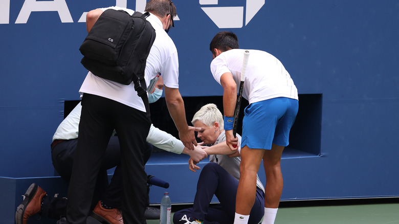 Djokovic tends to a judge