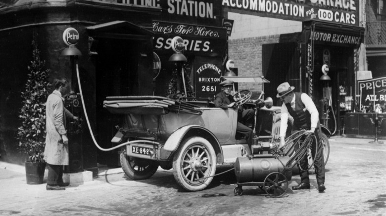 people at filling station 1924