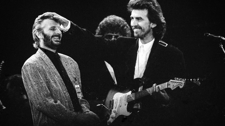 George Harrison and Ringo Starr performing together in 1987