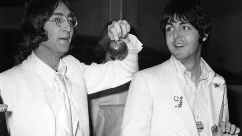 Paul McCartney and John Lennon standing together 1968