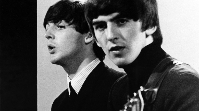 Paul McCartney and George Harrison performing together