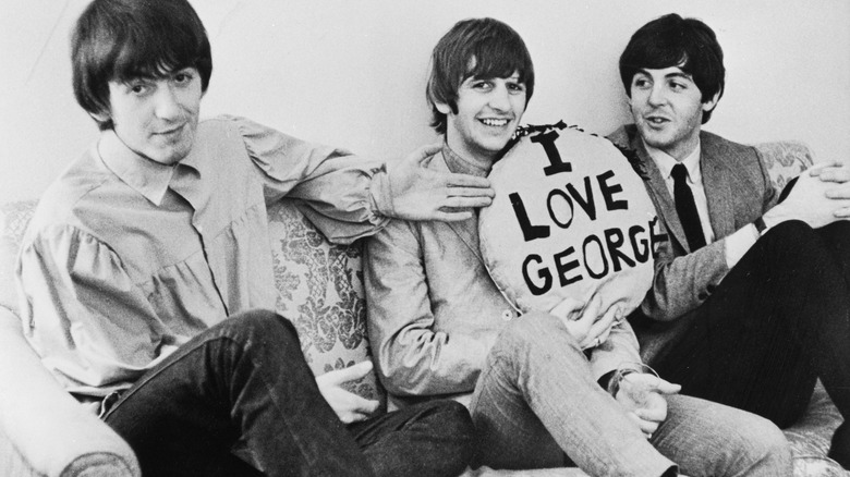 Paul McCartney and Ringo Starr, with a pillow I love George