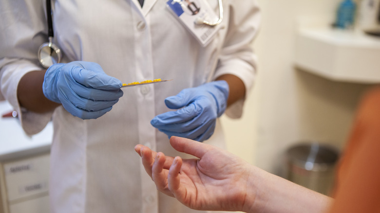 prison doctor checking on an inmate