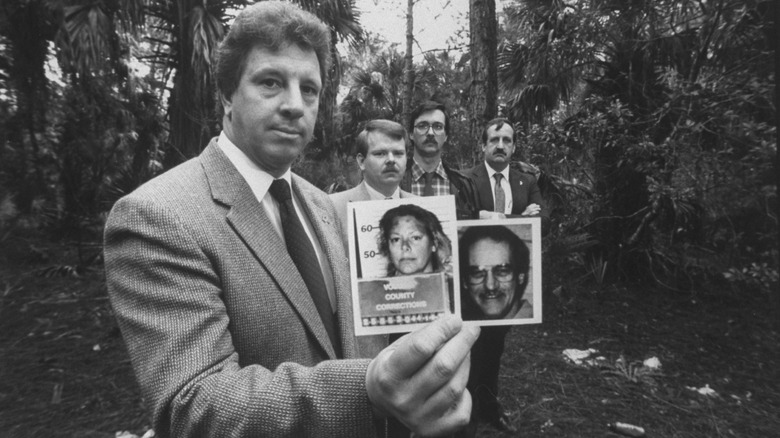 invesitgator holding picture of wuornos and victim