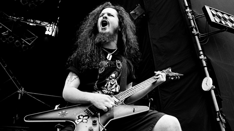 Dimebag Darrell posing with guitar