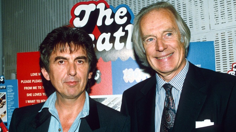 George Harrison and George Martin posing