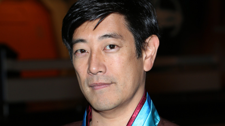 Grant Imahara looking thoughtfully into camera at Star Trek convention