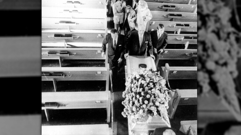 Mourners follow Jimi Hendrix's coffin in a church