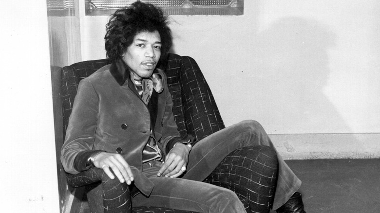 Jimi Hendrix sitting on an armchair