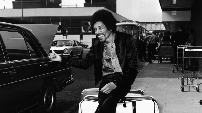 Jimi Hendrix pretending to be hitch hiking