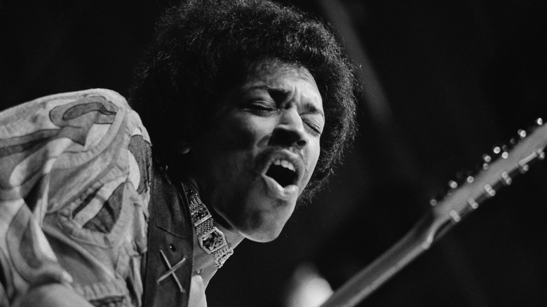 Jimi Hendrix making a face while playing at the Isle of Wight Festival