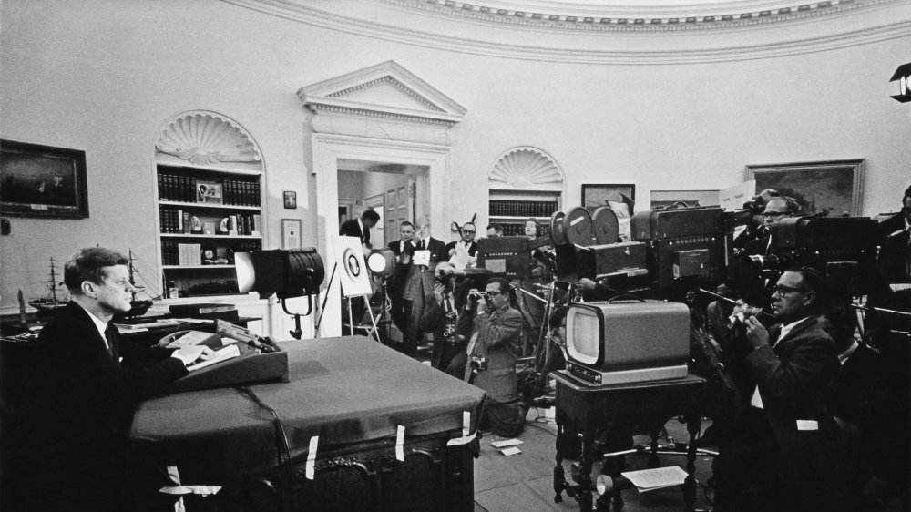 President John F. Kennedy announcing on television the strategic blockade of Cuba, and his warning to the Soviet Union about missile sanctions during the Cuban missile crisis, 22nd October 1962.